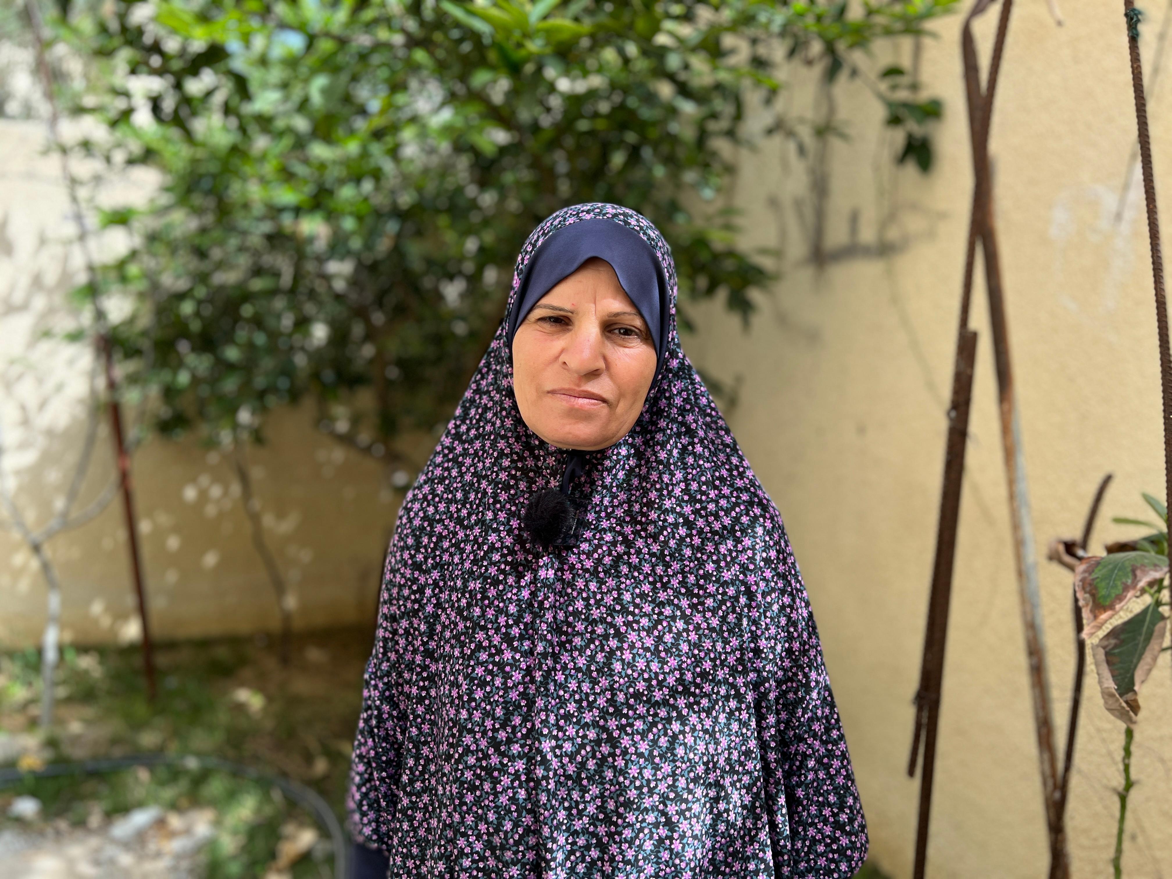 CH11015665_Roqaya, 50, standing in the aid distribution centre in Rafah, Gaza
