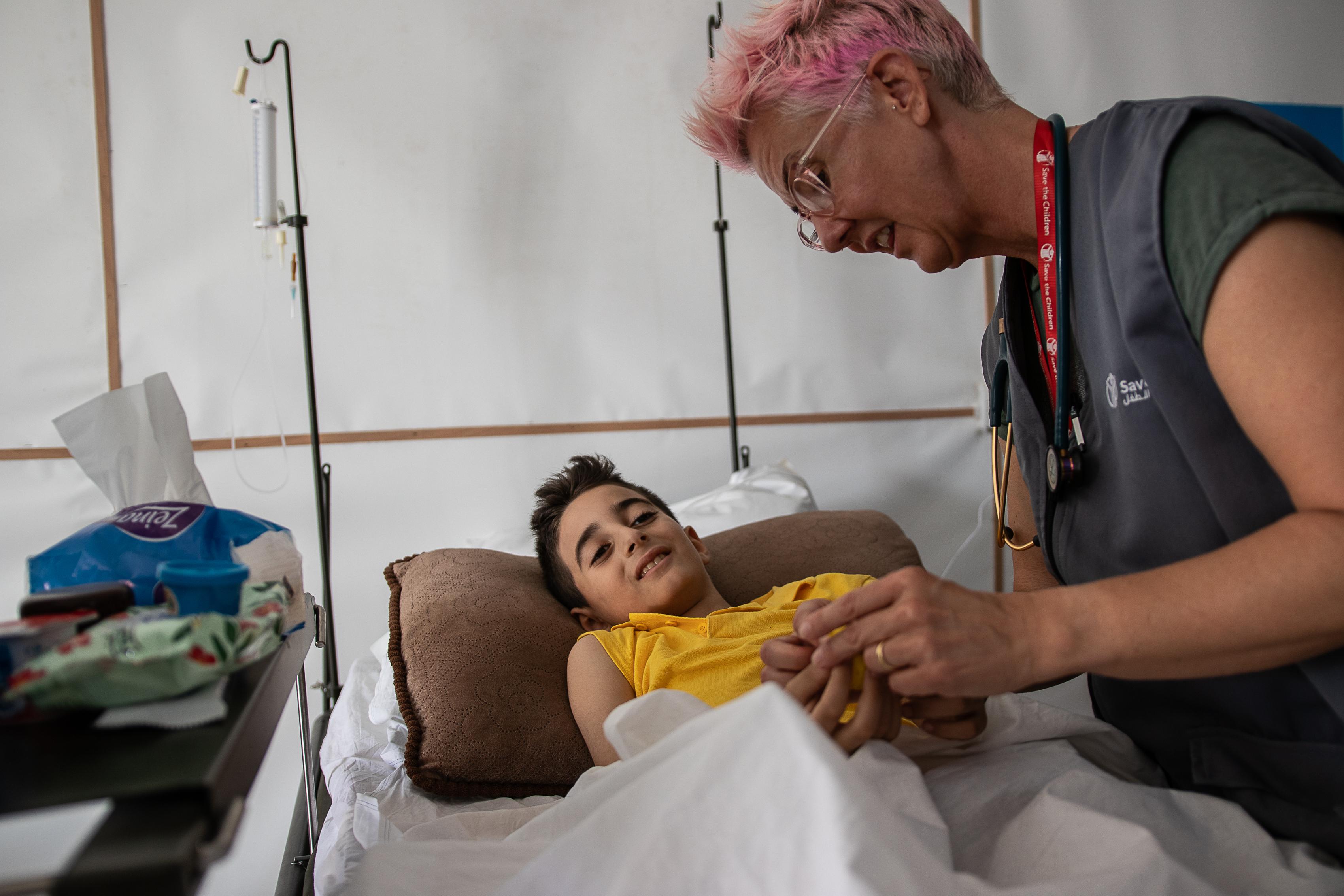 Pediatric nurse Becky tends to Ahmed*, 10, at a hospital in the Gaza Strip.