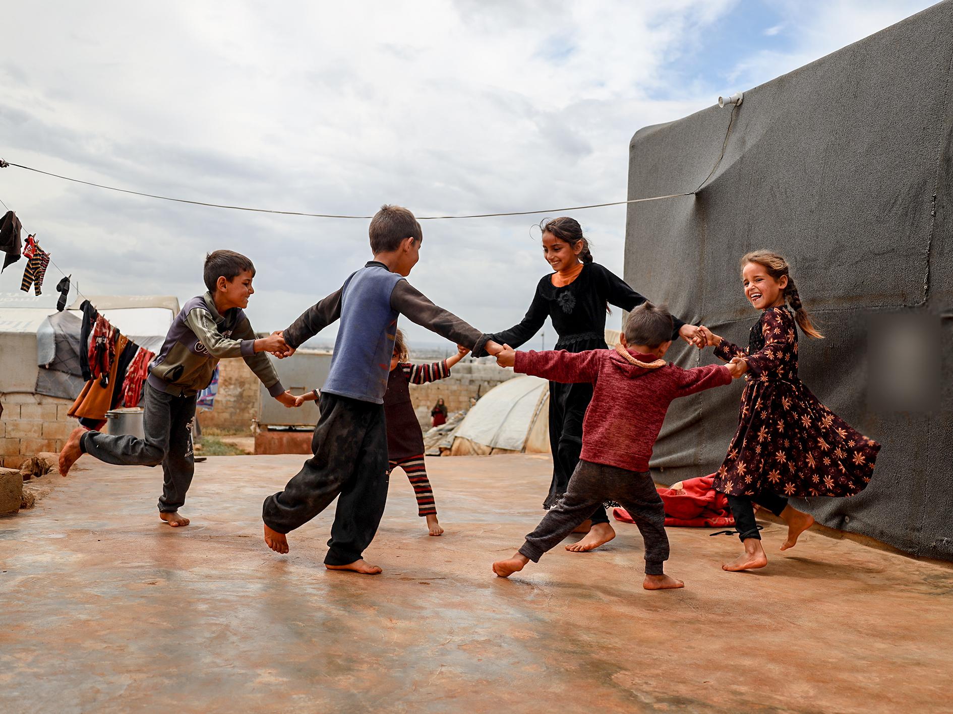 Asha and her siblings dancing