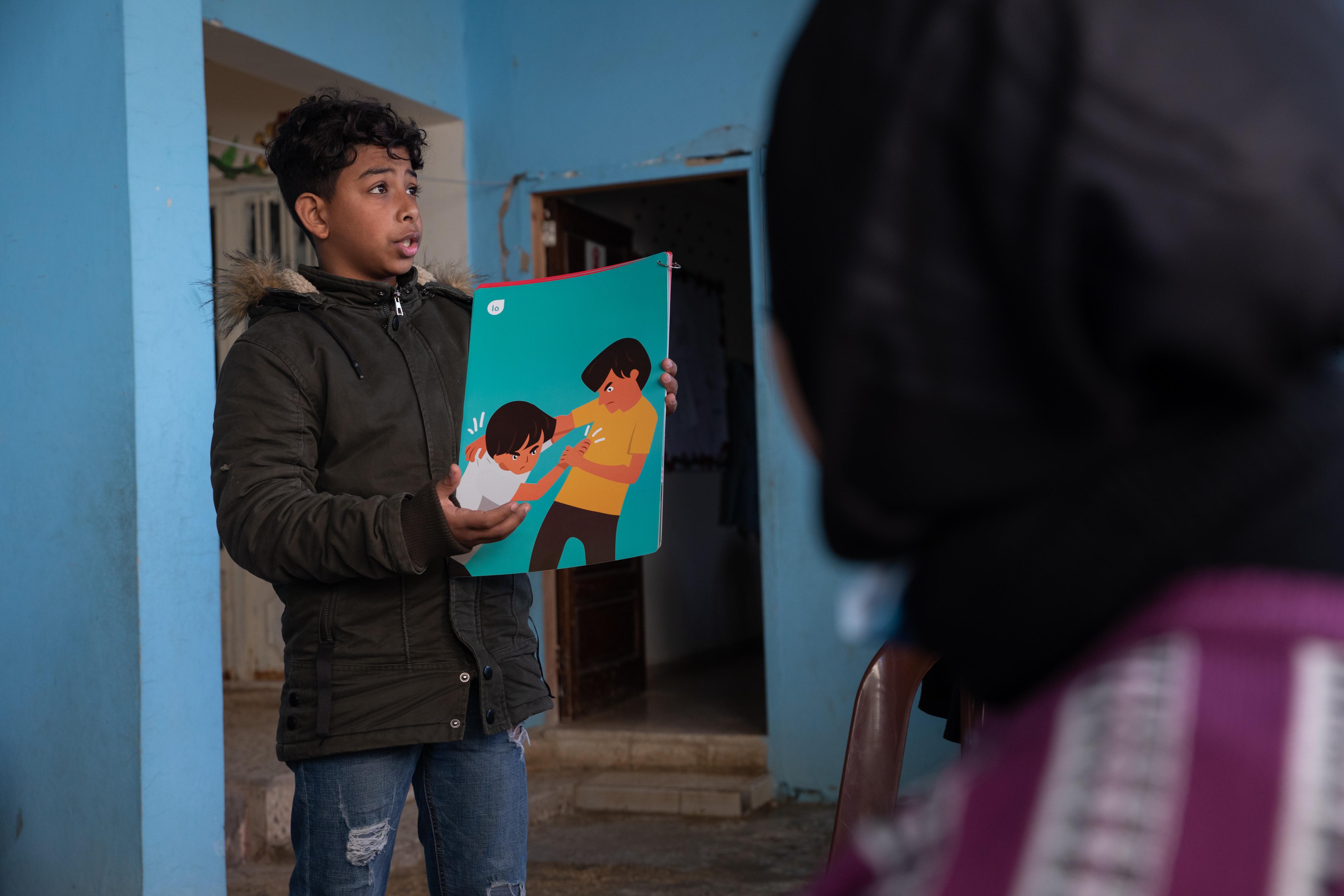 CH1689693_Adam, 14, takes part in a Child�s Rights and Governance session at a Save the Children sup