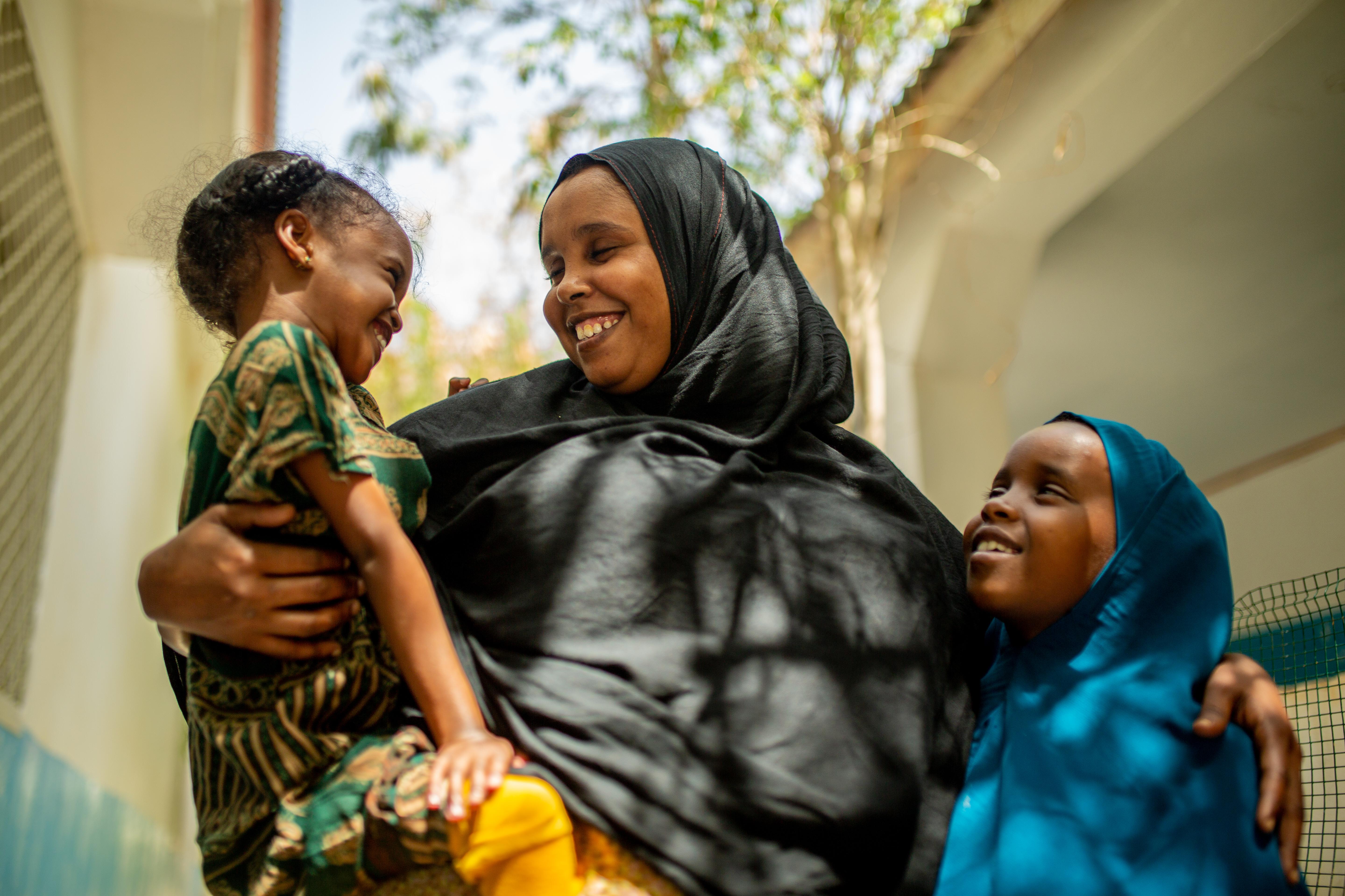 CH1696355_Yasmiin, 28, with daughters Ubah, four, and Amran, eight, at a stabalisation centre for ch