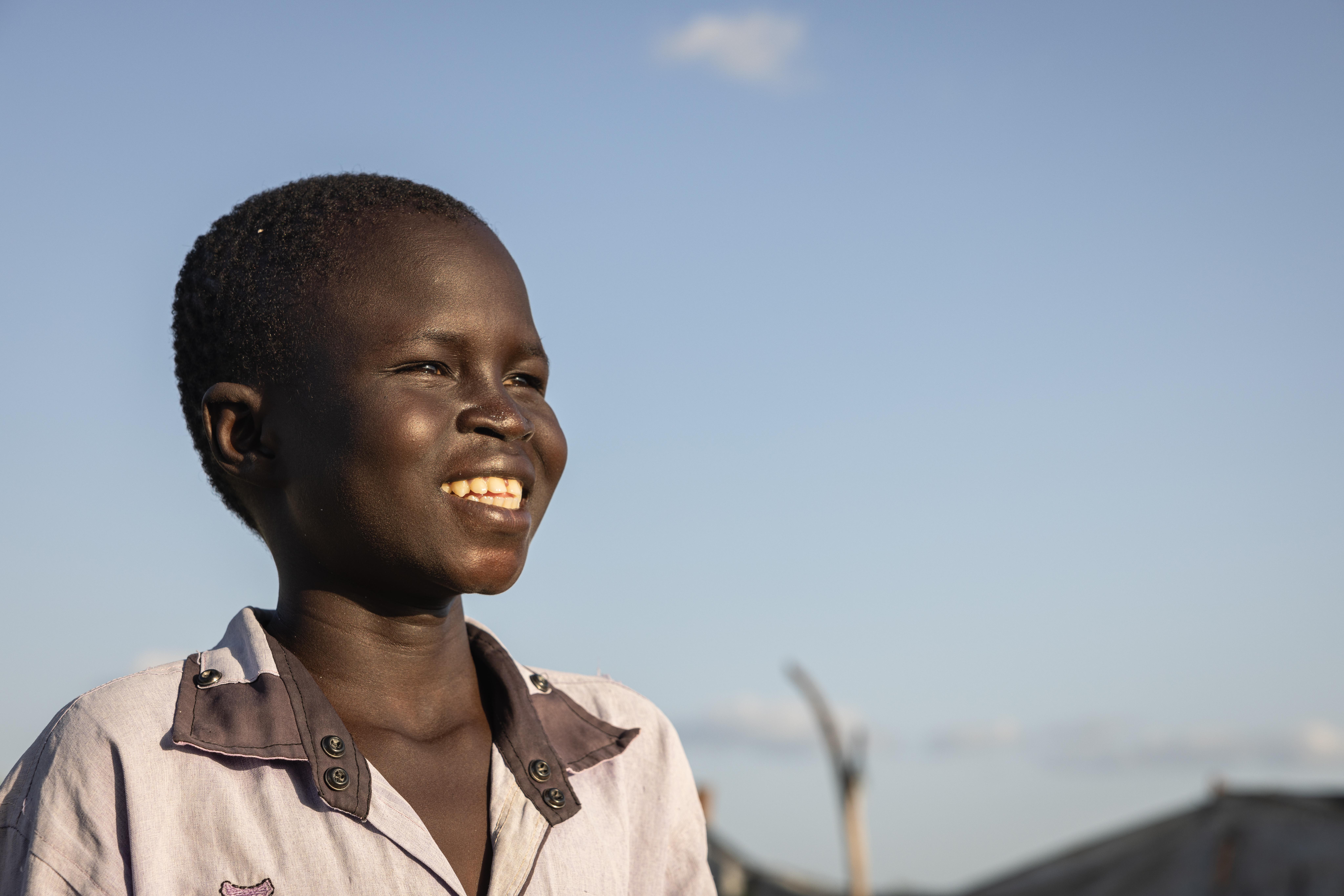 CH1703671_A portrait of Jok, 12, outside his home in Akobo West, South Sudan.