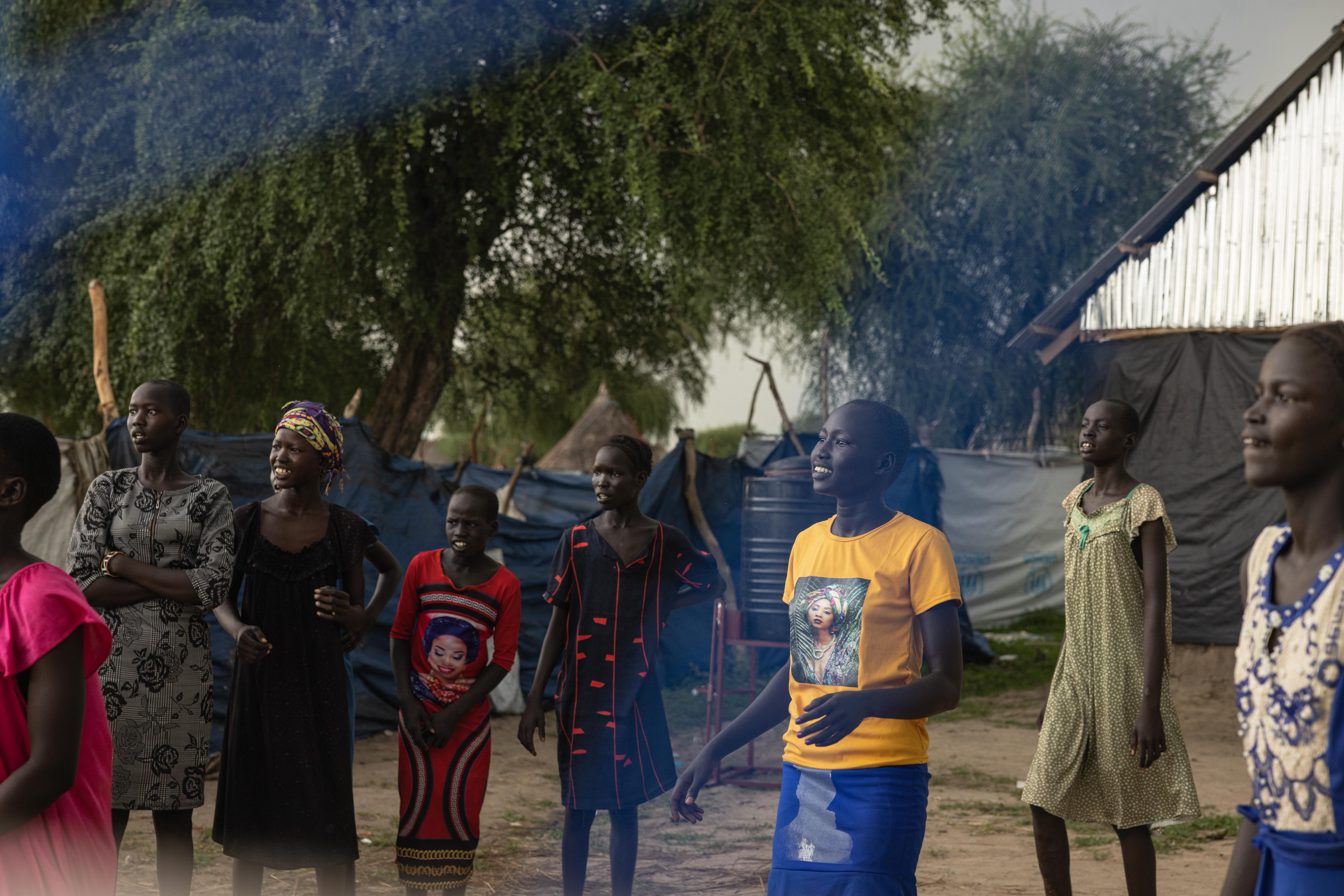 Ayen plays volleyball with friends at the Save the Children-run Child-Friendly Space in her community.