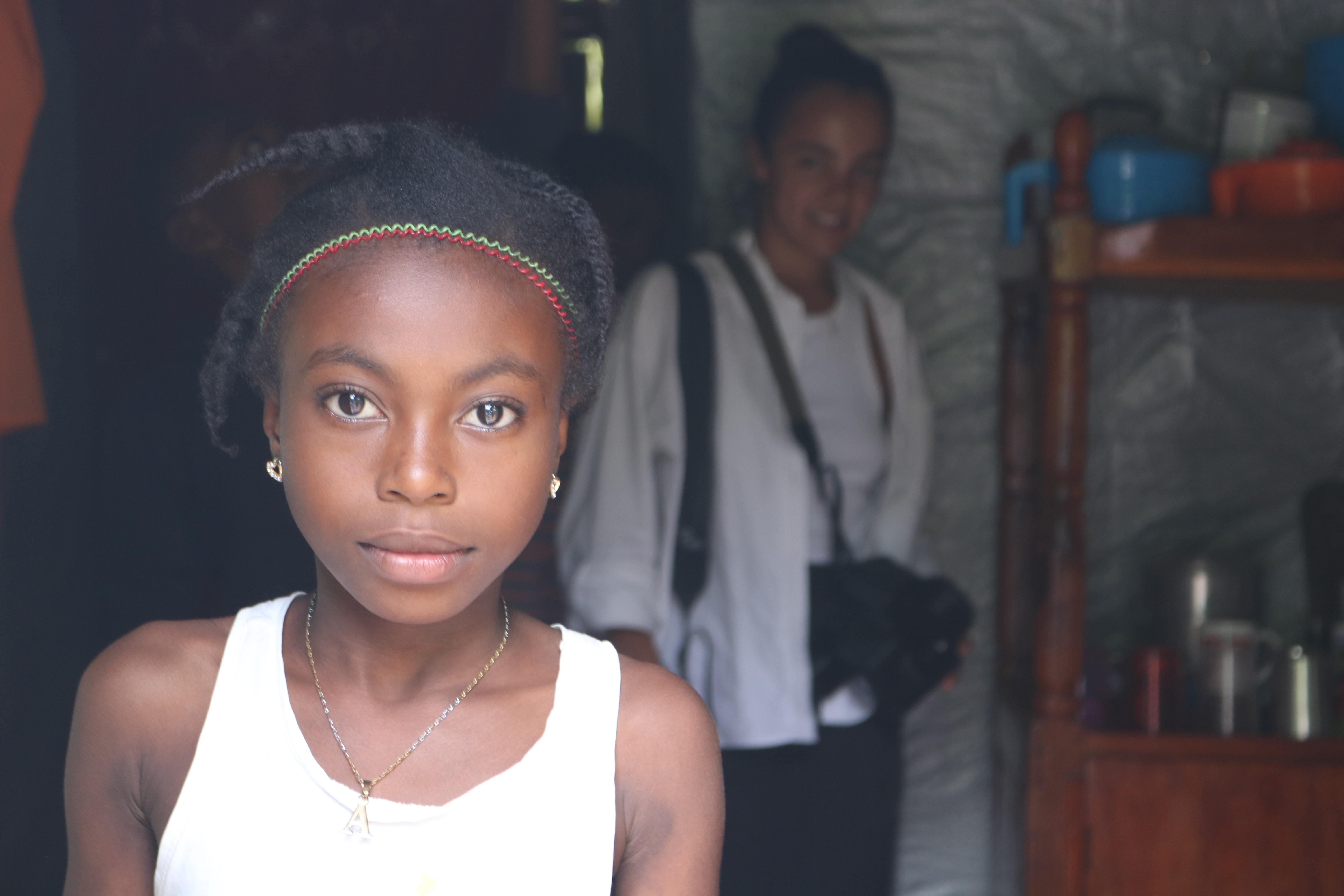CH1704210_Entha, 10, standing inside her house.