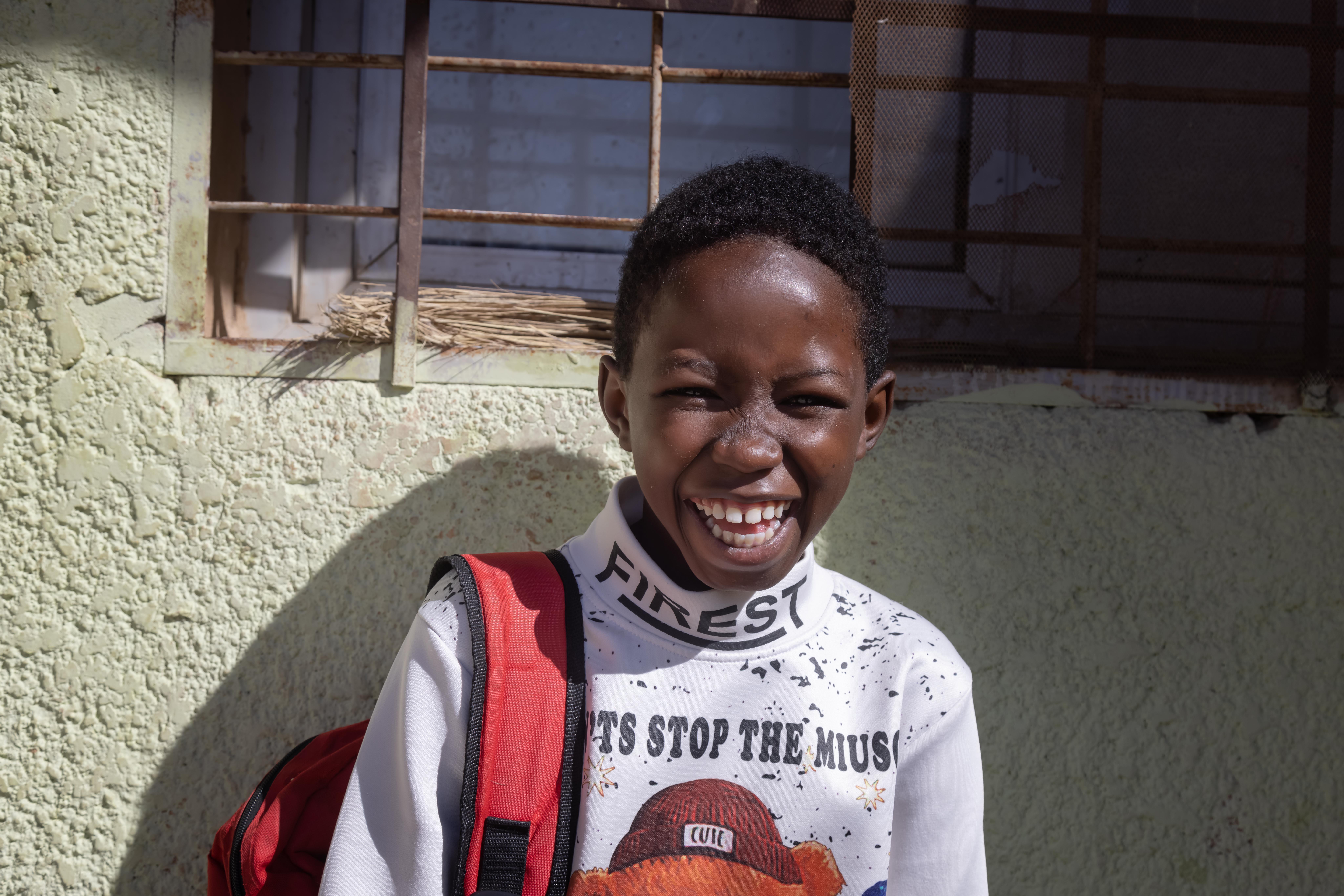 CH1801157_Asaad, 13, poses for a portrait outside his home.