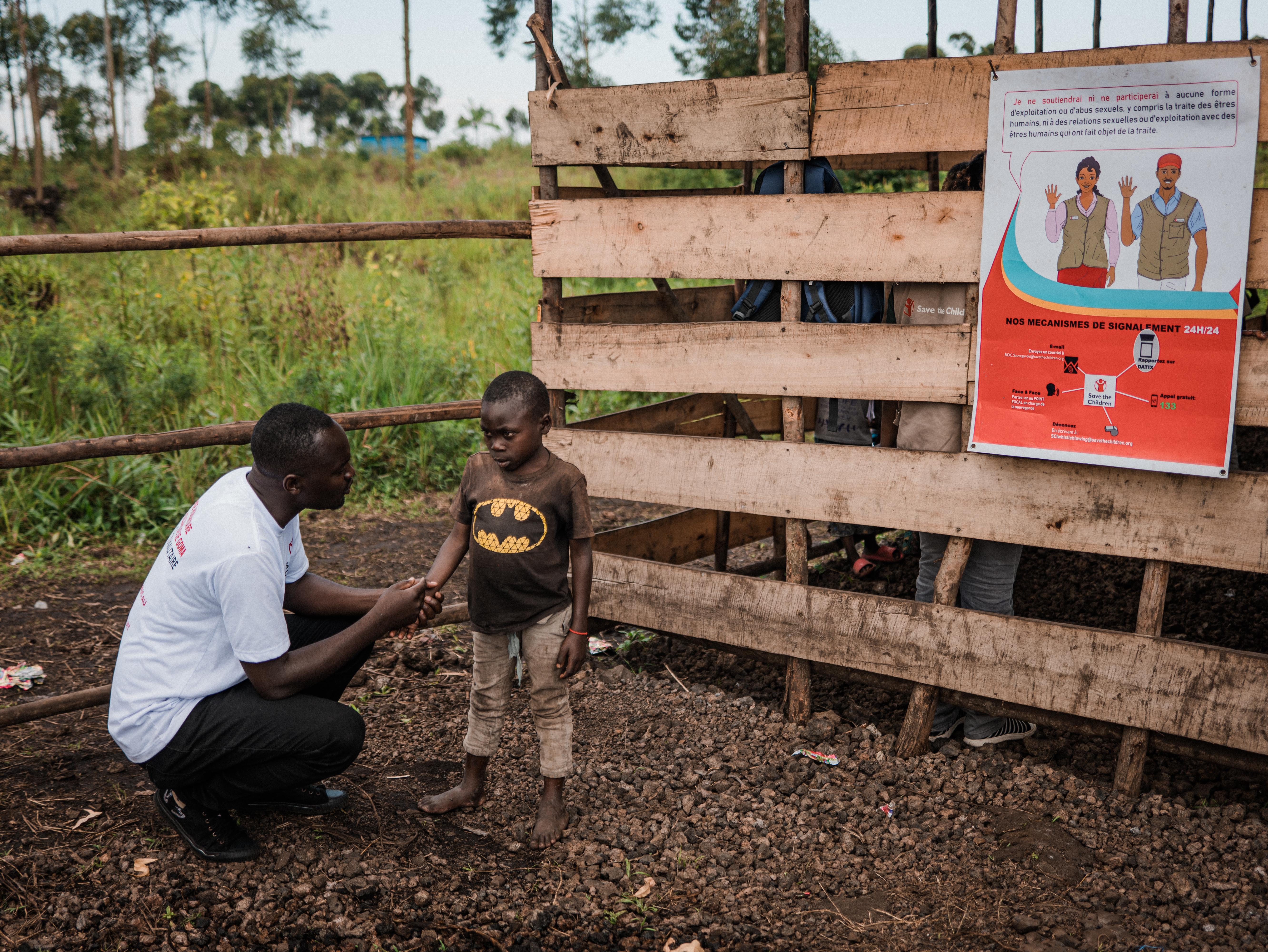 CH1807790_Joseph, 10, speaks to partner staff member Justin at the CFS