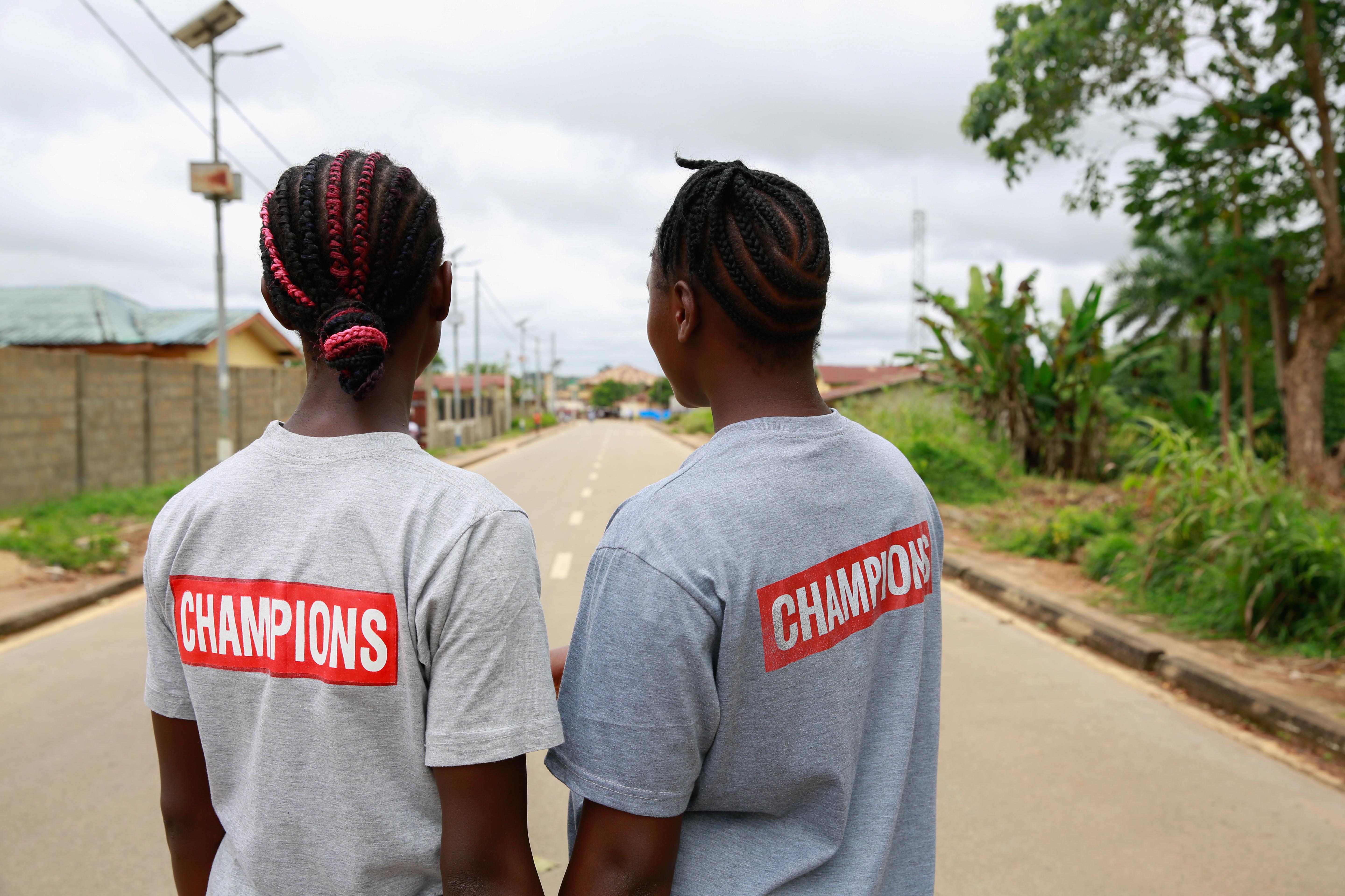 CH1875899_Cousins Kuji, 19 and Kpemeh, 18 wear their Ending Child Marriage Champion t shirts in Kail