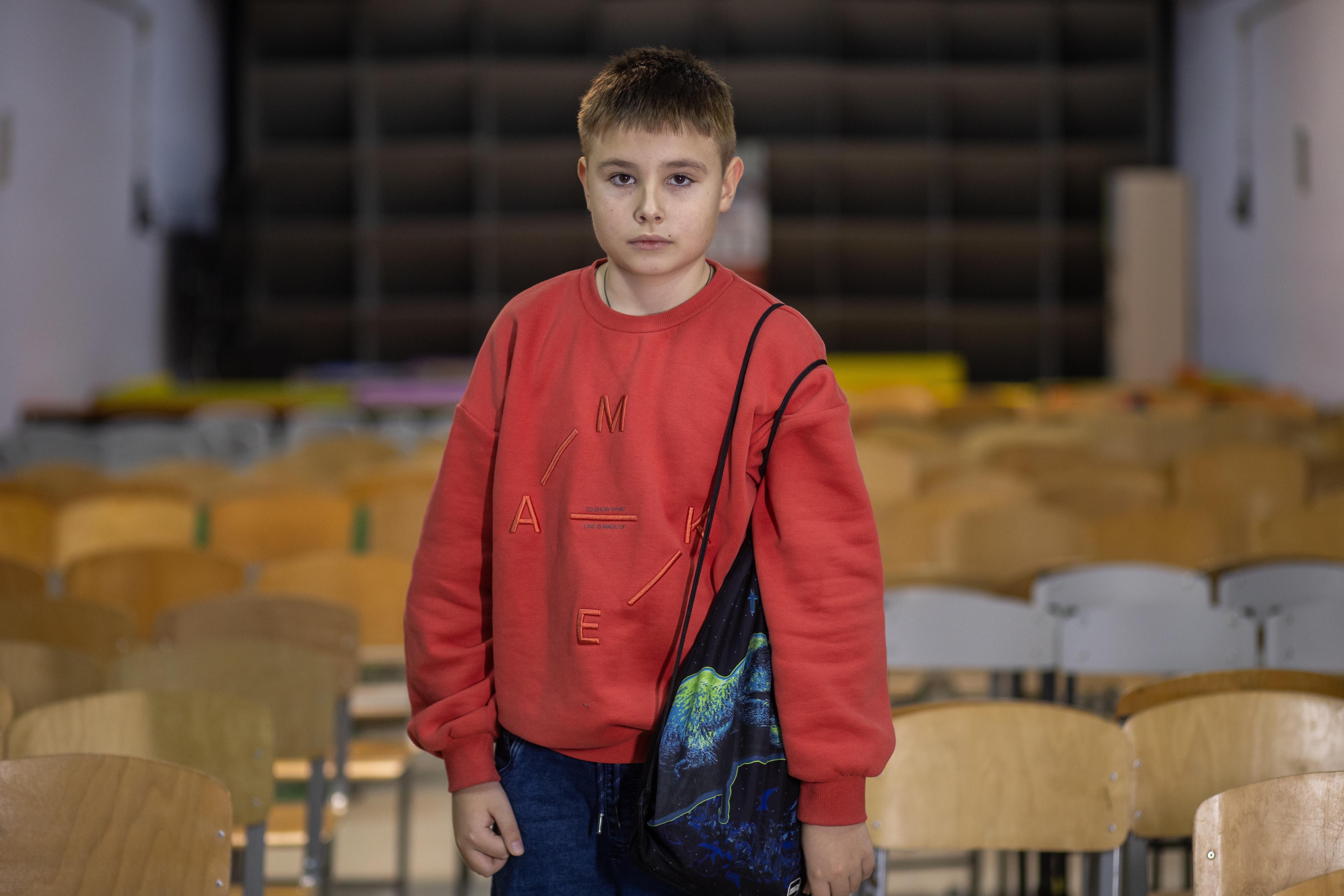 Roman with his grab bag in his school shelter in Kyiv