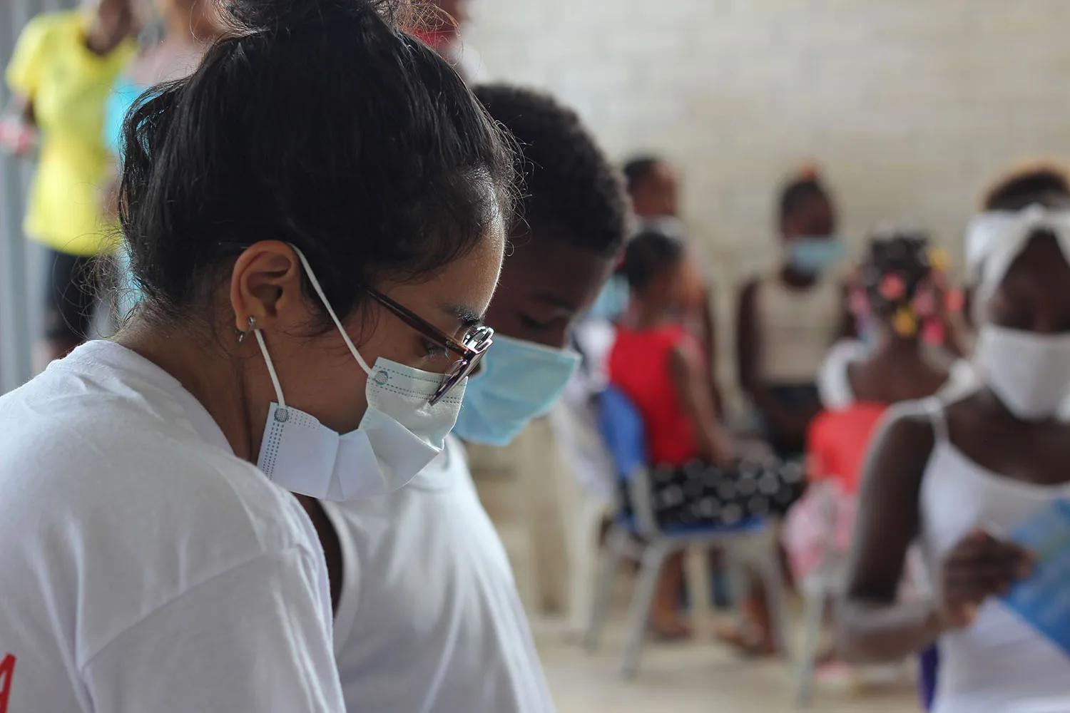Save the Children Education in Emergencies manager, Ayse Kocak, attends a temporary learning session inside a classroom in an informal settlement��� on the Venezuelan-Colombian border.