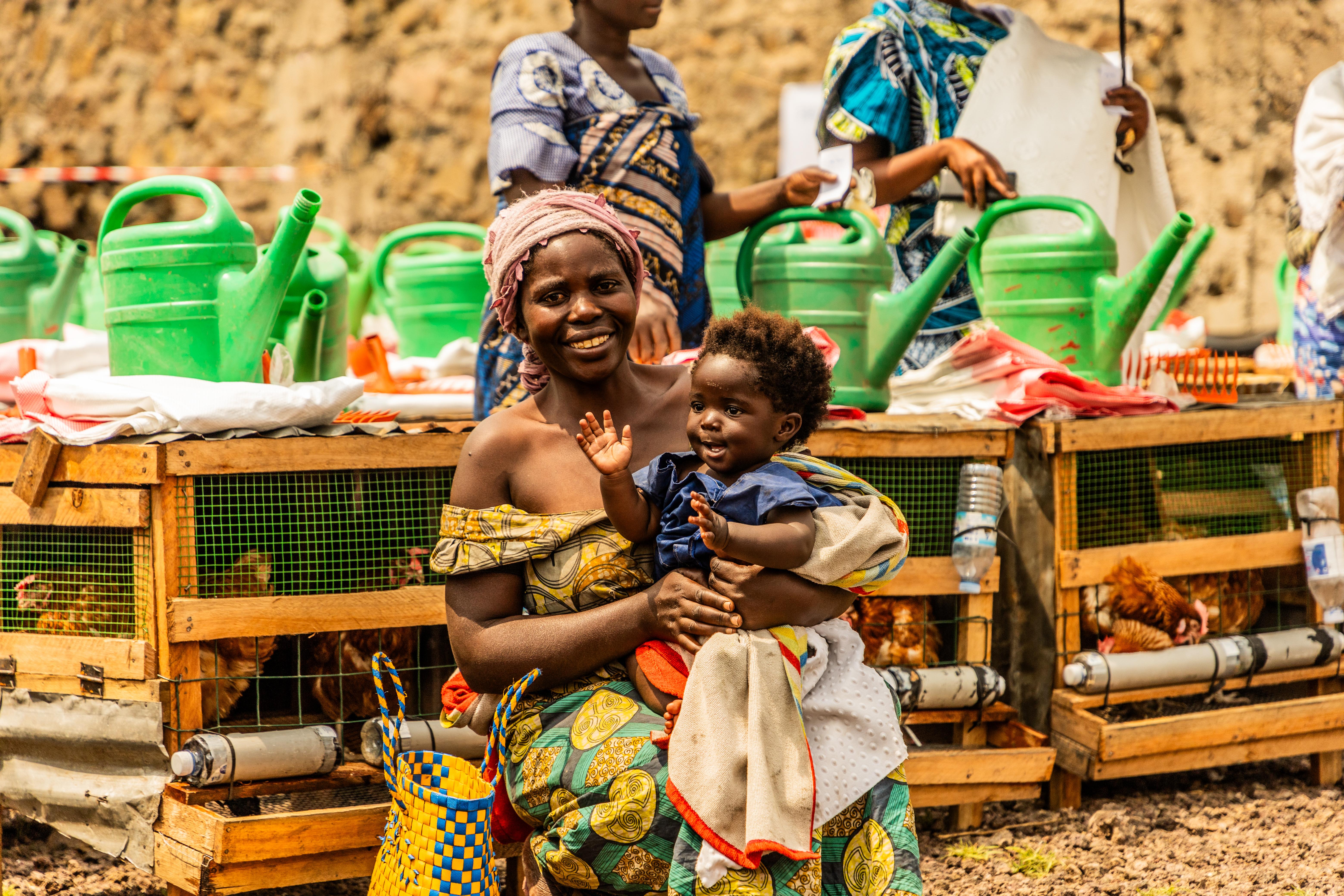 Brigitte*, 30, & Cecile*, 5 months at a distribution site in DRC