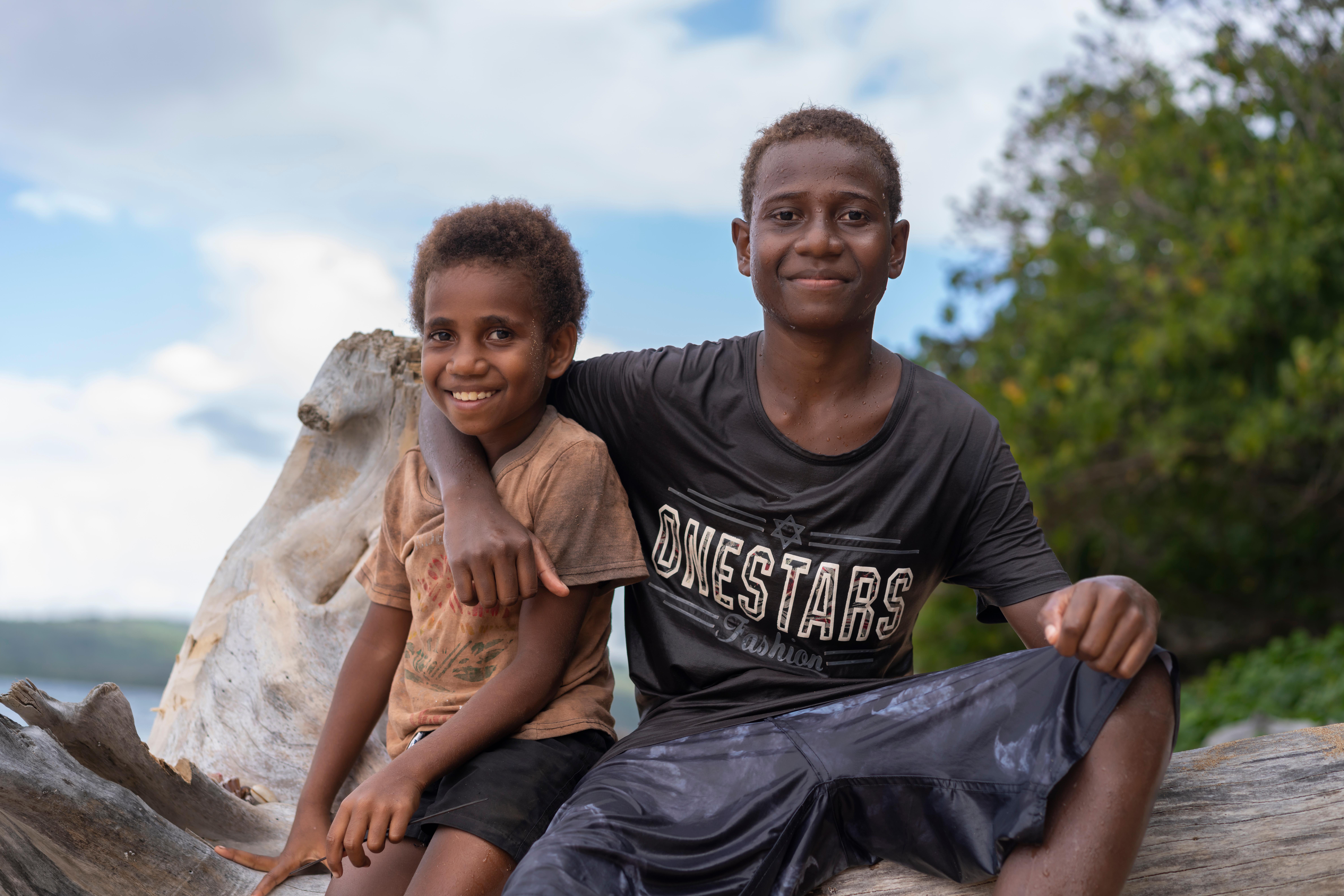 Charlie, 14, and his younger sister Agnes, 7, on an island in Shefa Province, Vanuatu.