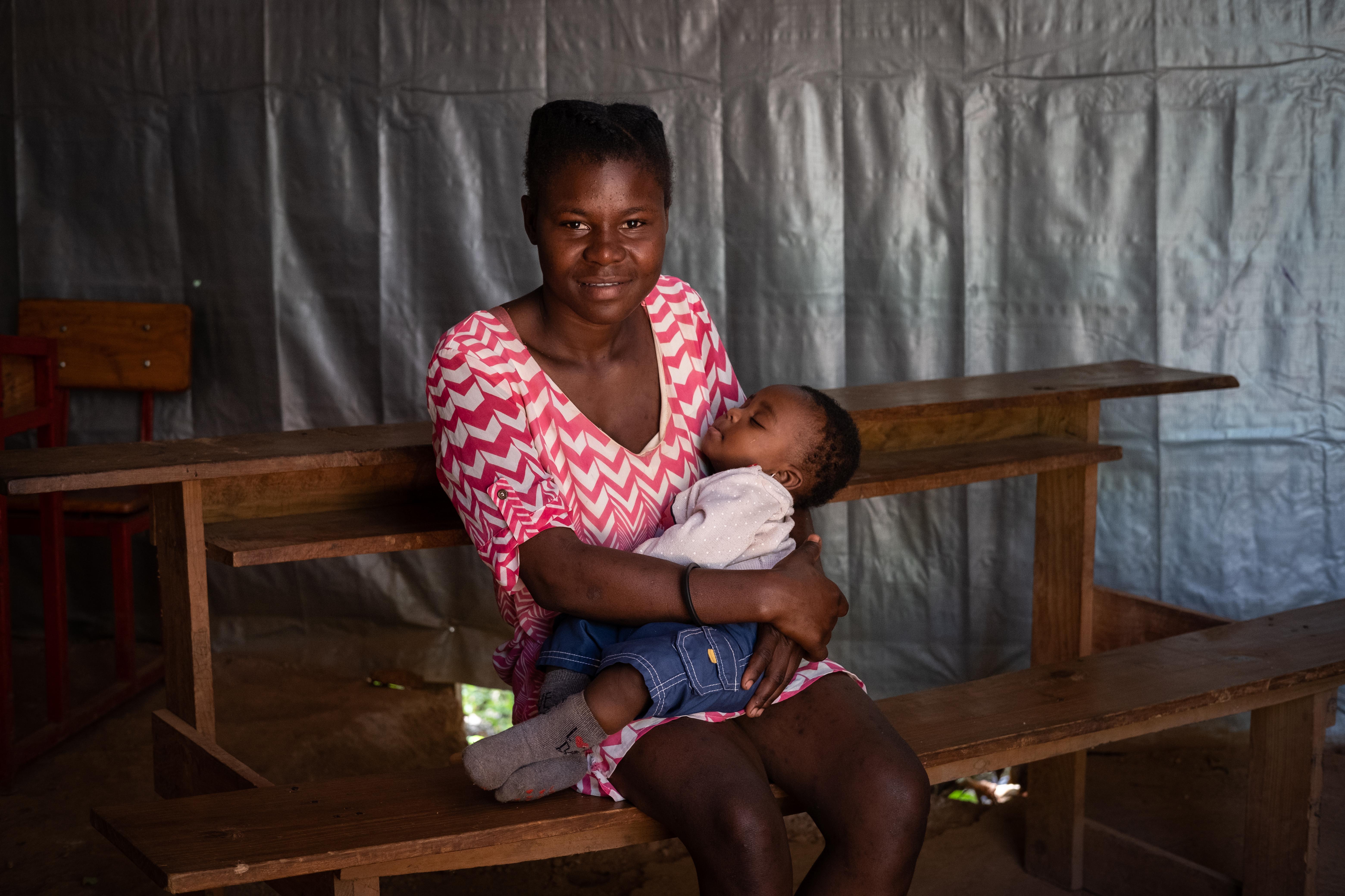 Esther, 19, and her son Alexis at the Save the Children mother and baby area in south west Haiti