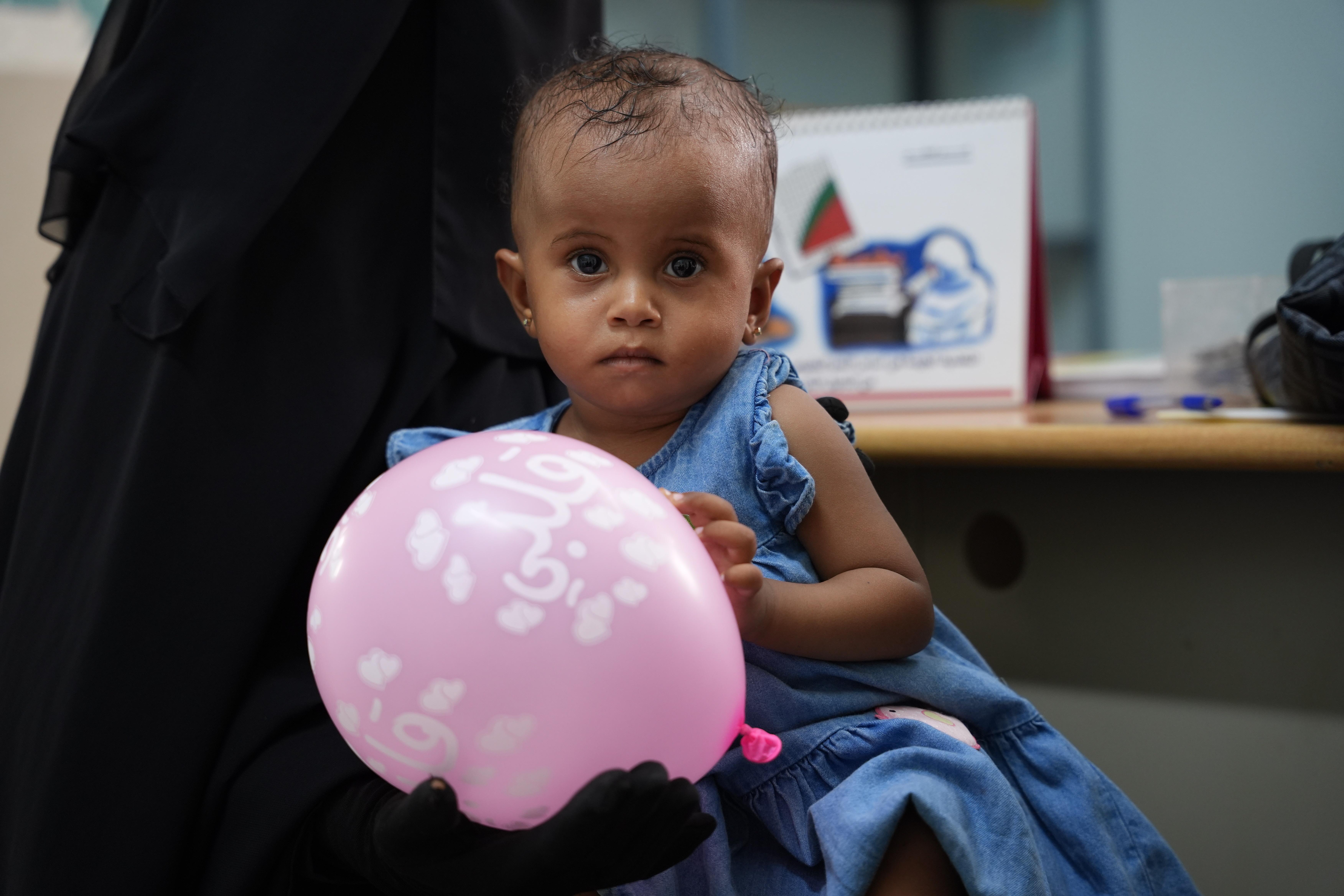 Maha*, 13-month-old,  receives follow-up care at the health facility after recovering from malnutrition, Lahj, Yemen
