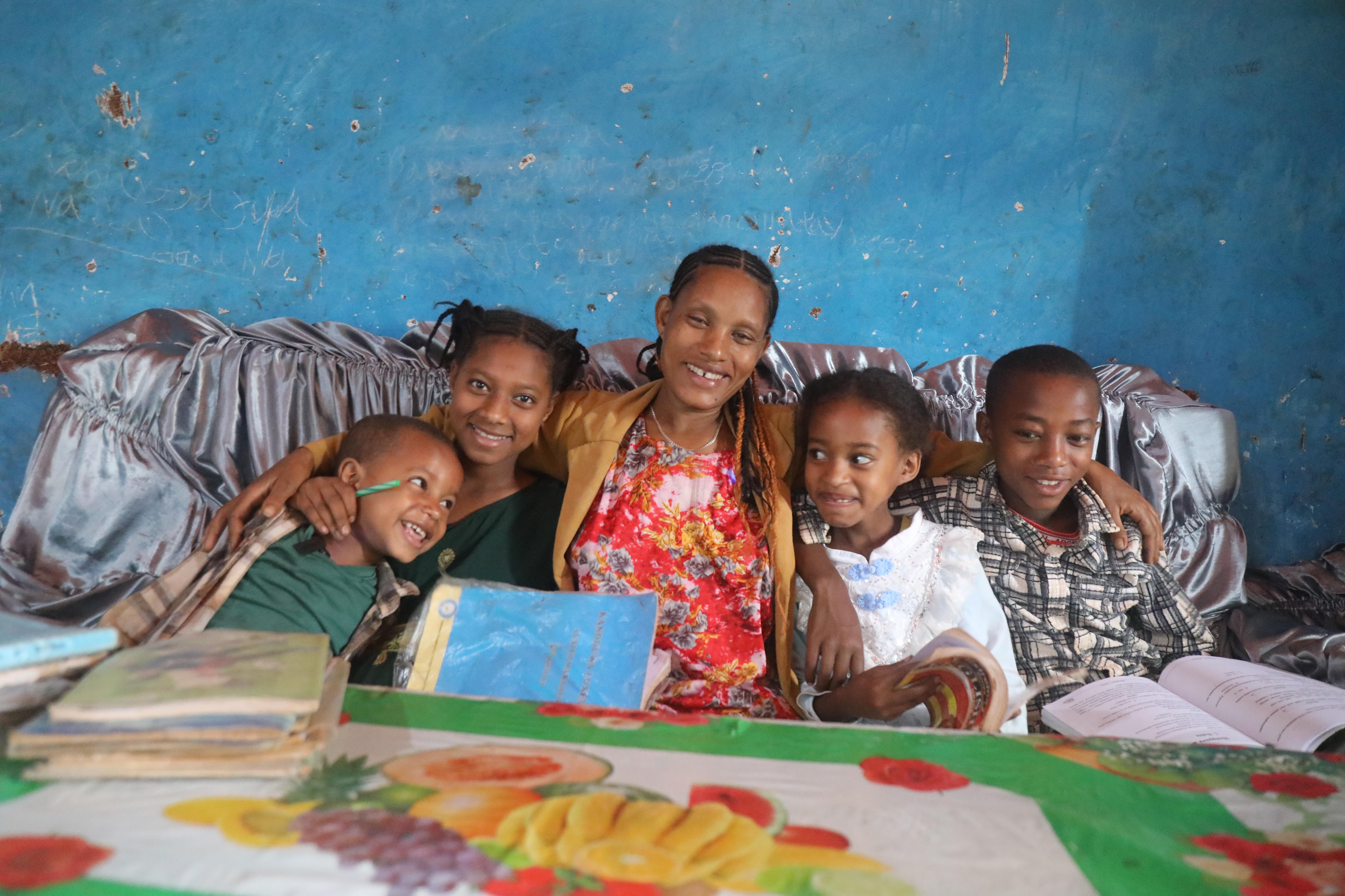 Meseret* and her children take a break from their homework