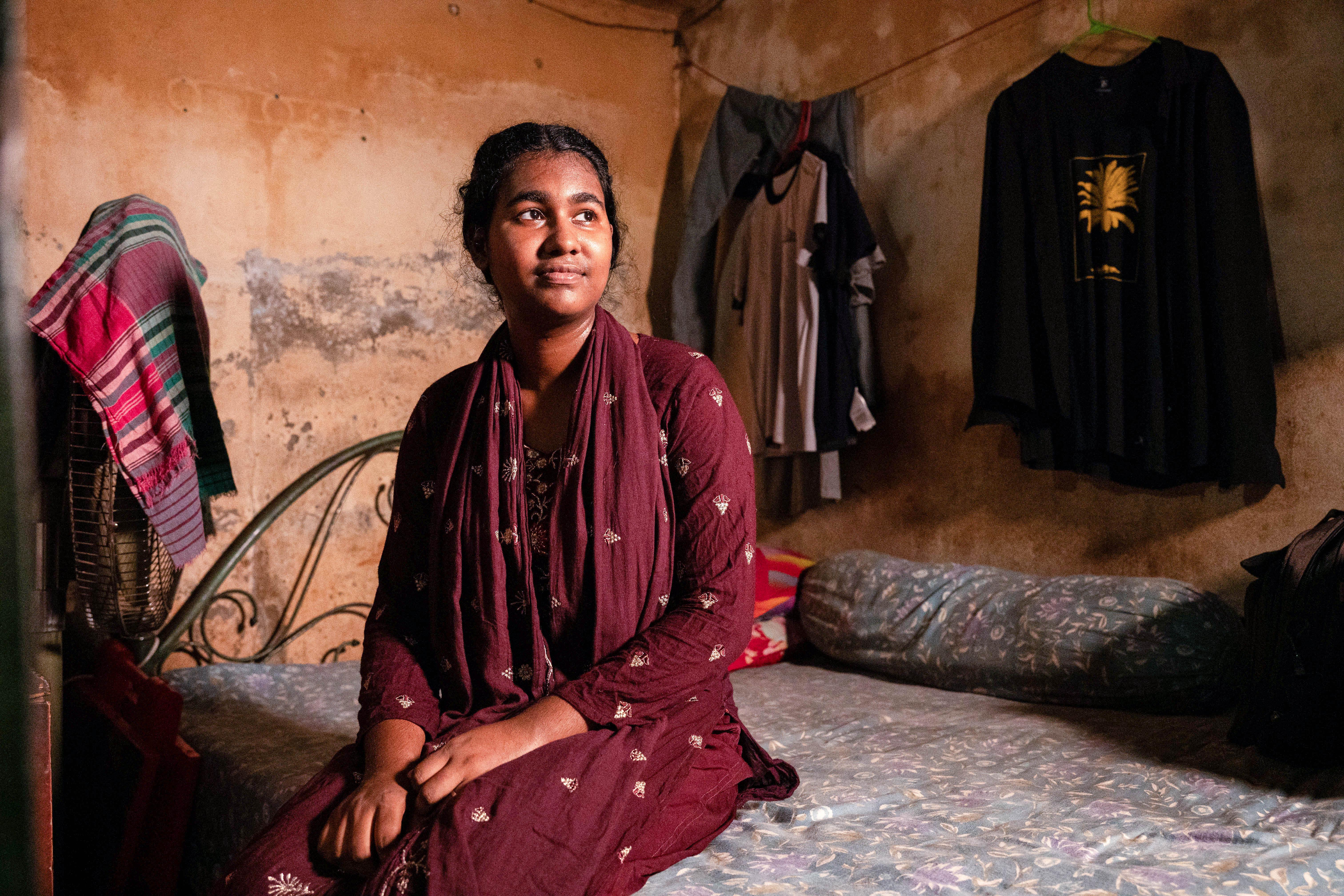 Mim* sat on her bed at home in Dhaka, Bangladesh as captured by Shefali Rafiq