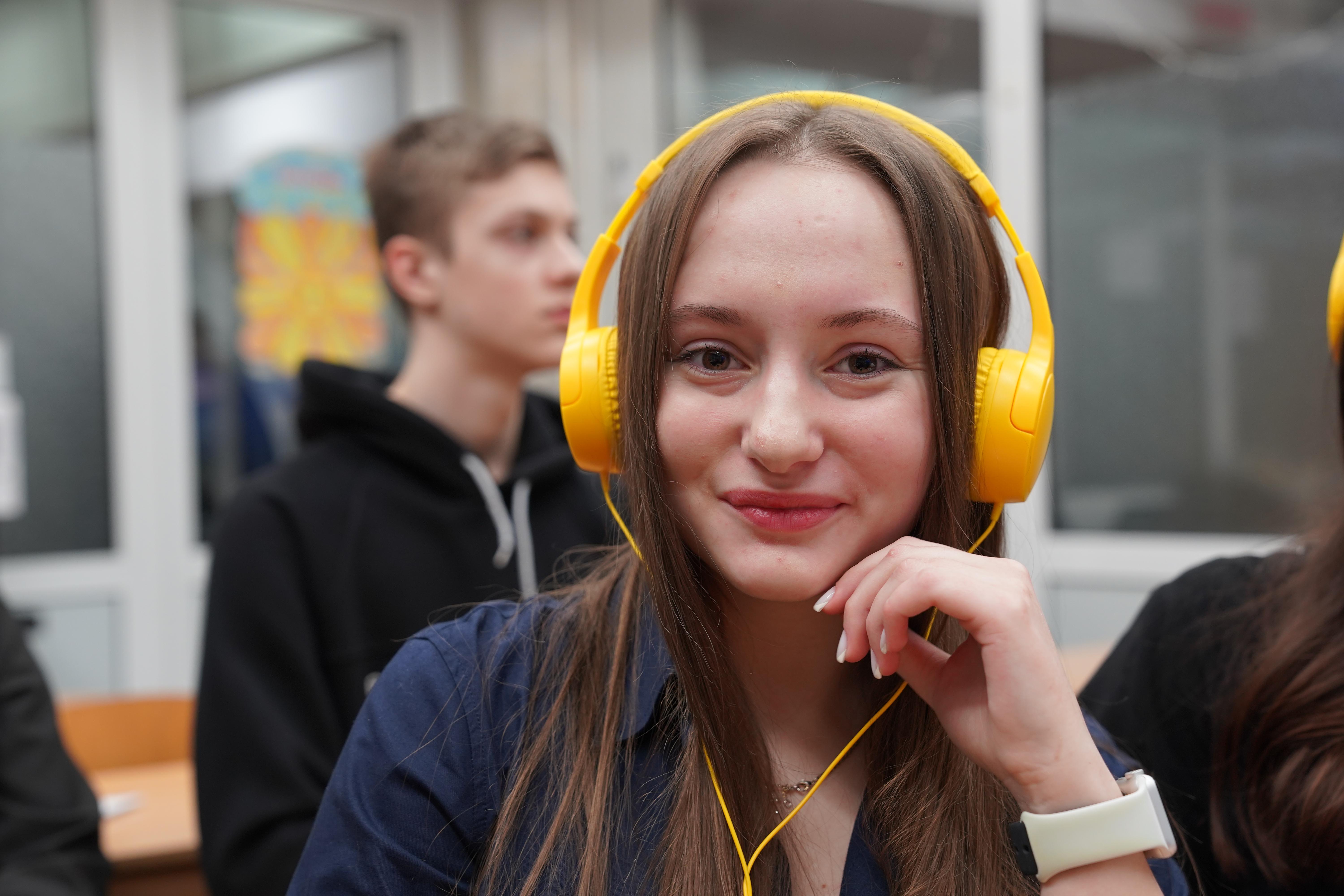 Olena*, 16, poses for a photo during classes at a subway school in Kharkiv, Ukraine
