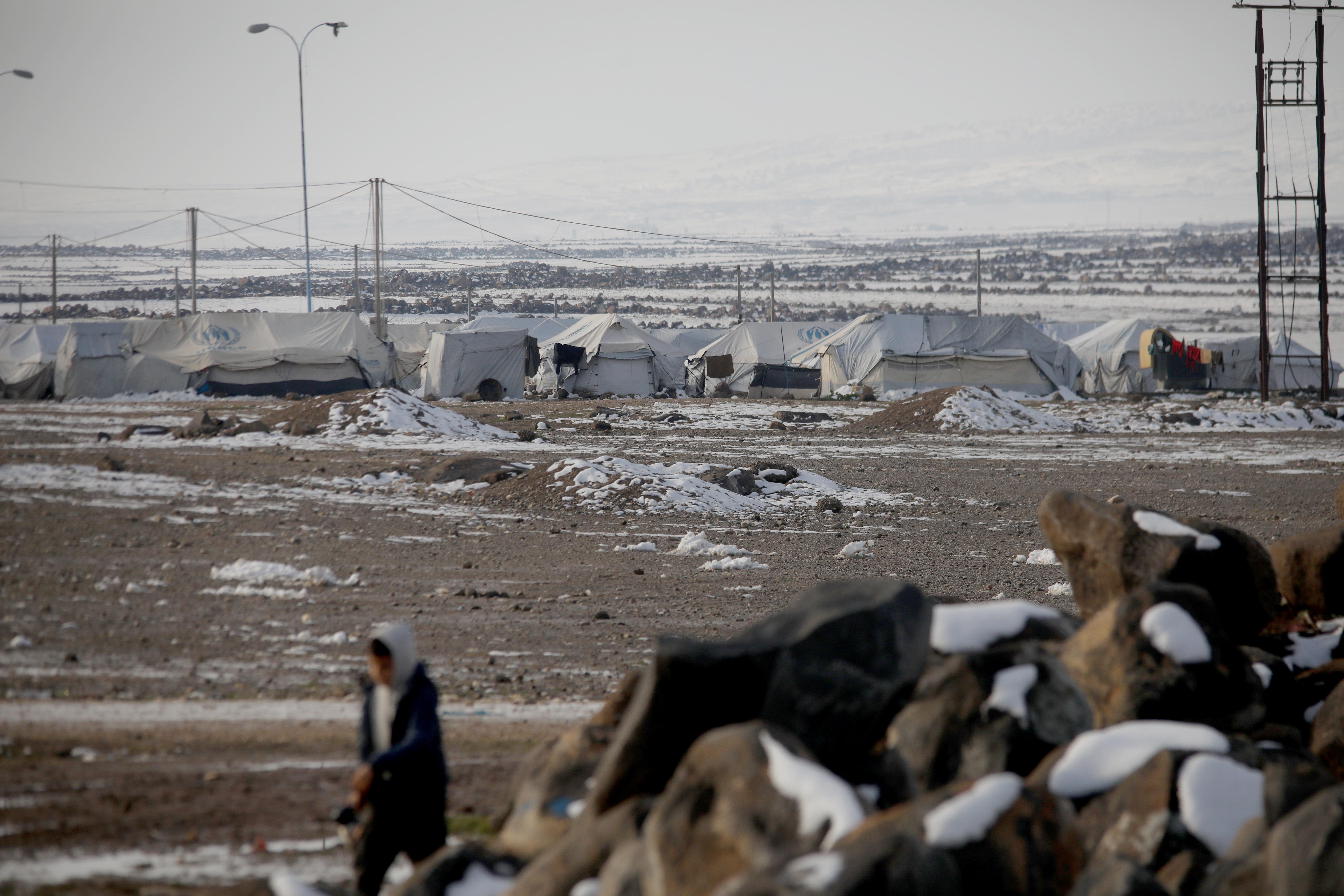 Snowy conditions at a displacement camp where families are living