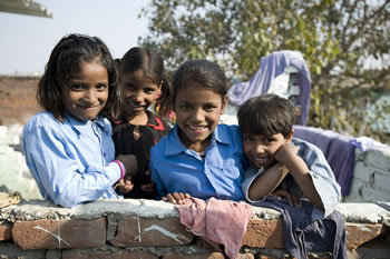 Girls on in Sanjay Colony, New Delhi, India. Sanjay Colony is a slum in Delhi, which is home to 11,000 people. Save the Children supports a mobile health clinic, staffed by a doctor, nurses and a pharmacist. Rachel Palmer / Image Save the Children