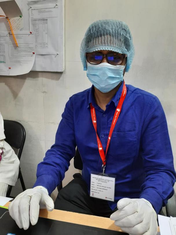 Abdus Sobhan wearing personal protective equipment (PPE) to work on the frontline.