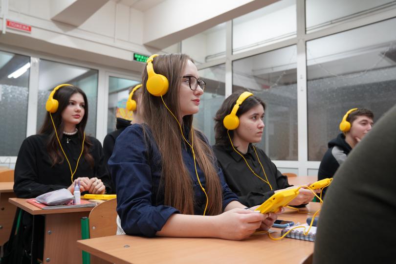 Children complete a listening test during classes at a subway school in Kharkiv, Ukraine