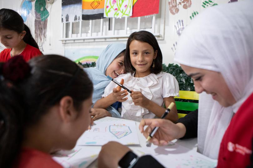 Lina*, 12, drawing at a Girls Empowerment Centre, run by Save the Children, in Zaatari Refugee Camp, Jordan.