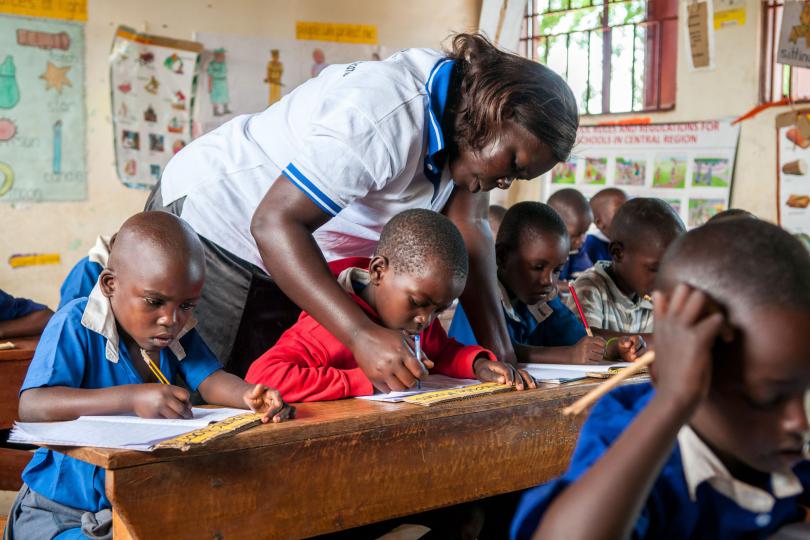 Students concentrating hard in rural Uganda (before COVID-19)