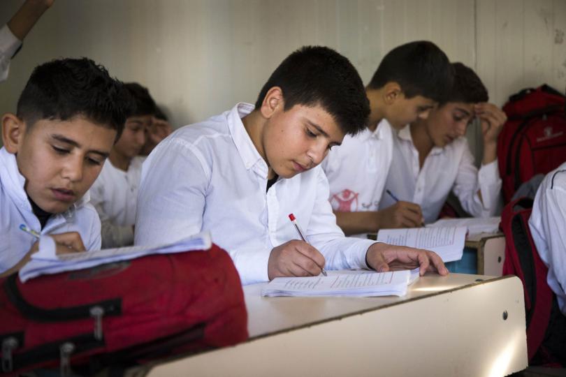 Ranveer, 13, from Syria, at school in Iraq, before the COVID-19 pandemic