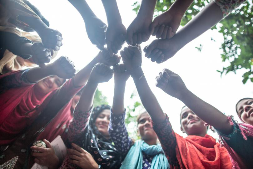 A group of girls in a circle at a peer-led village workshop designed to inform and empower girls, Sylhet, Bangladesh
