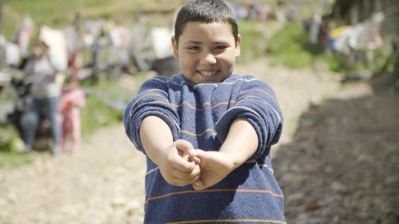 Daniel*, 10, demonstrates the steps to handwashing, Mexico