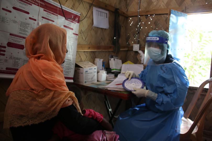 Sharmin, a frontline healthcare worker provides family planing counselling at Save the Children's Primary Health Care Centre in Cox's Bazar, Bangladesh