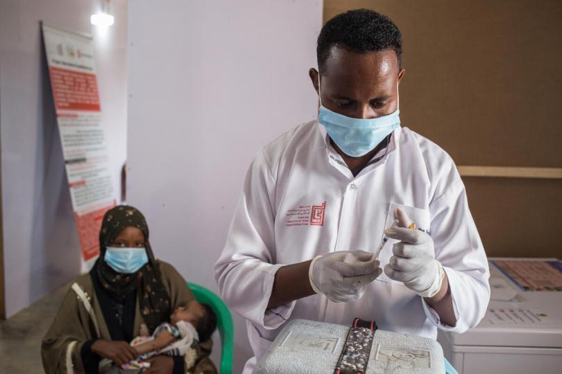 Health worker Ahmed vaccinates a child - MHC, Burao Somalia