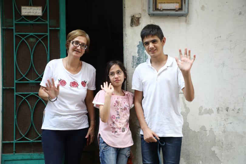 Marie-Helene with daughter Lama*, 11, and son Jad*, 14, outside their home, Beirut, Lebanon