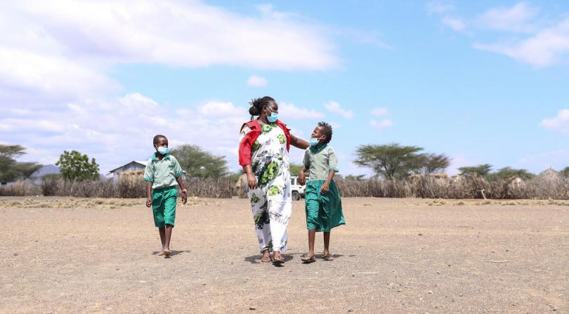 Miriam Atonia interacting with children from the community