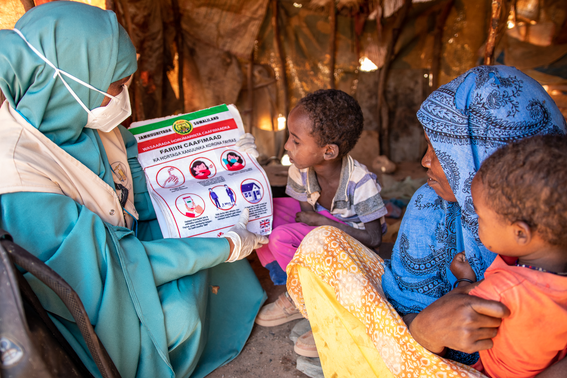 Muna showing guidance to some children