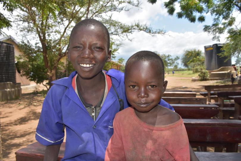 Sagal ,10, sits with his 4-year-old brother, Emmanuel, as they wait for lunchtime at a community school in the Karamoja region of North Eastern Uganda