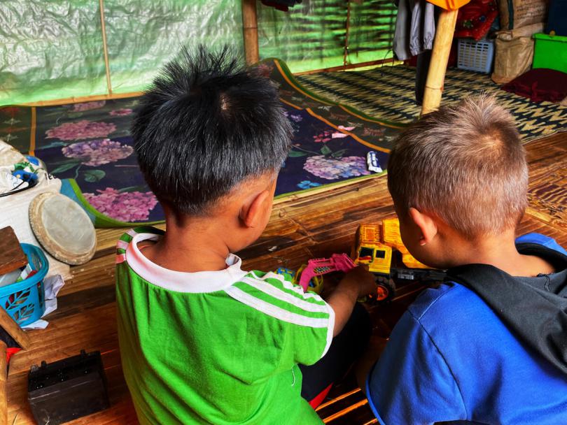 Lay Lay*'s sons playing inside their shelter at the IDP camp, Myanmar
