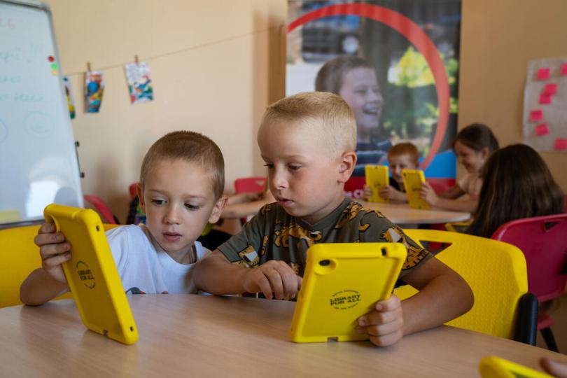Children using tablets in class at a mobile Digital Learning Centre in Mykolaiv region, Southern Ukraine.