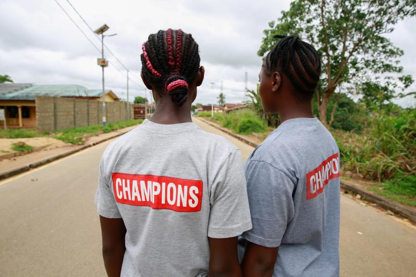 Cousins Kuji, 19 and Kpemeh, 18 wear their Ending Child Marriage Champion T-shirts in Kailahun, Sierra Leone