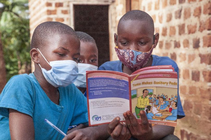 Children reading in a Catch-Up club in Uganda