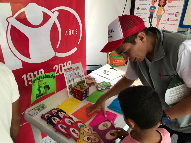  Wilfredo working at the child friendly space.