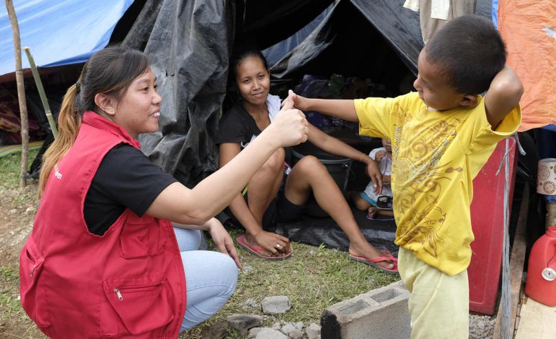 A member of Save the Children staff speaks with evacuees in the town of Makilala, North Cotabato, Philippines, that were affected by the 6.6 magnitude earthquake on 29th October 2019