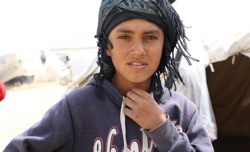 Ahmad stands in Al Hol camp, Syria