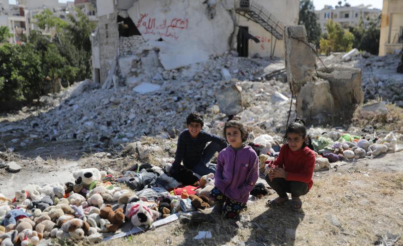 Dara*, 10, her brother Tamer*, 11, and sister Asma*, 7, sell toys to provide for their family.