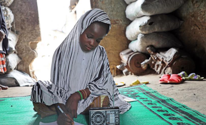 Asmau*, 12, studies at home thanks to radio learning supported by Save the Children in Nigeria