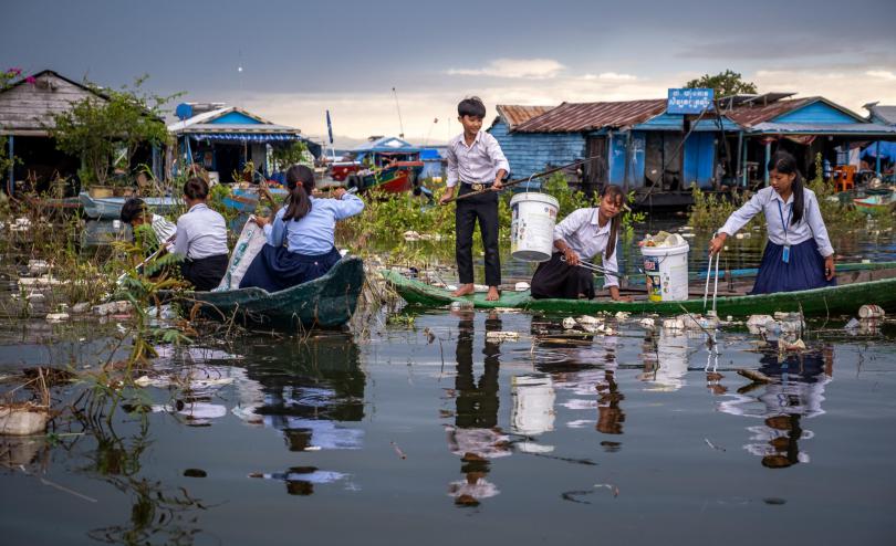 Ratana, 12, and her classmates collect rubbish from Tonle Sap Lake, Cambodia. 