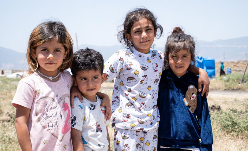 Alaa*, 5, Luai*, 3, Nasrin*, 9, & Saba*, 5, in their tent village where they live with their 28- year-old mother, Salma*, in Turkey.