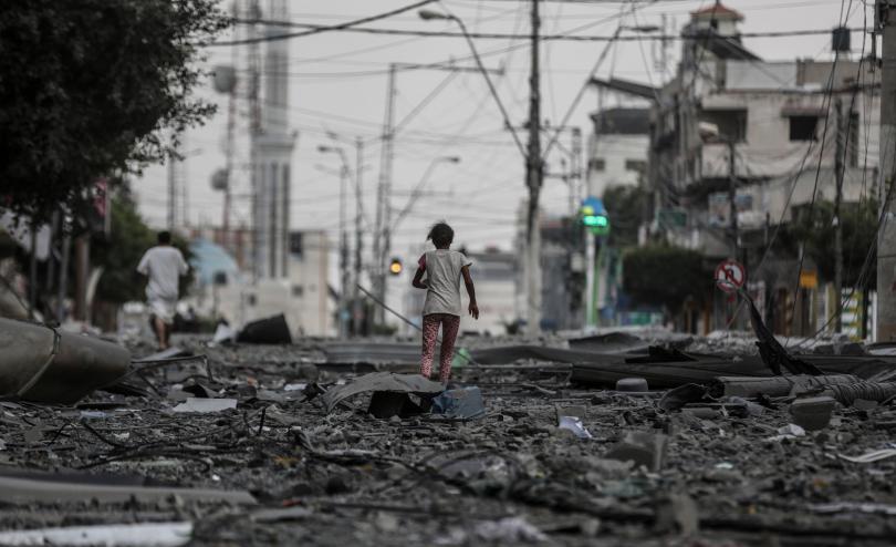 Child runs through rubble after Israel's airstrikes in Gaza