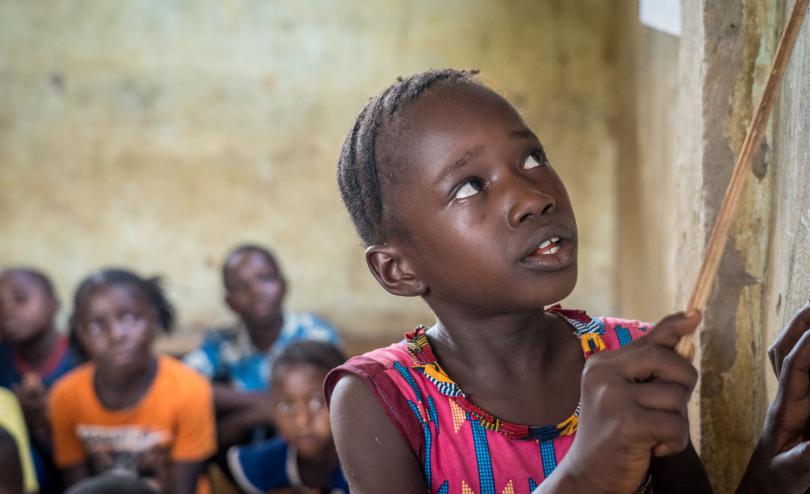 A girl reads in Sierra Leone