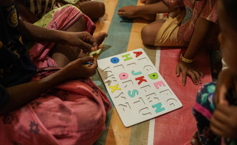 A group of Rohingya children play puzzles in a session carried out by the Geutanyoe Foundation, Save the Children's local partner, in a camp in Aceh, Indonesia.