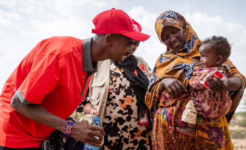 Save the Children Ambassador Sir Mo Farah meets Aisha* and her malnourished son Hassan*